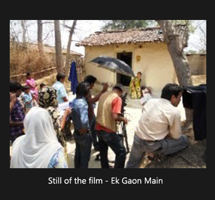 Still from the film "Ek Gaon Main," showcasing a pivotal moment in the storyline with key characters in focus.